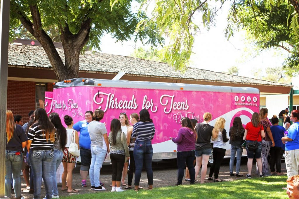 The crowd outside the mobile boutique